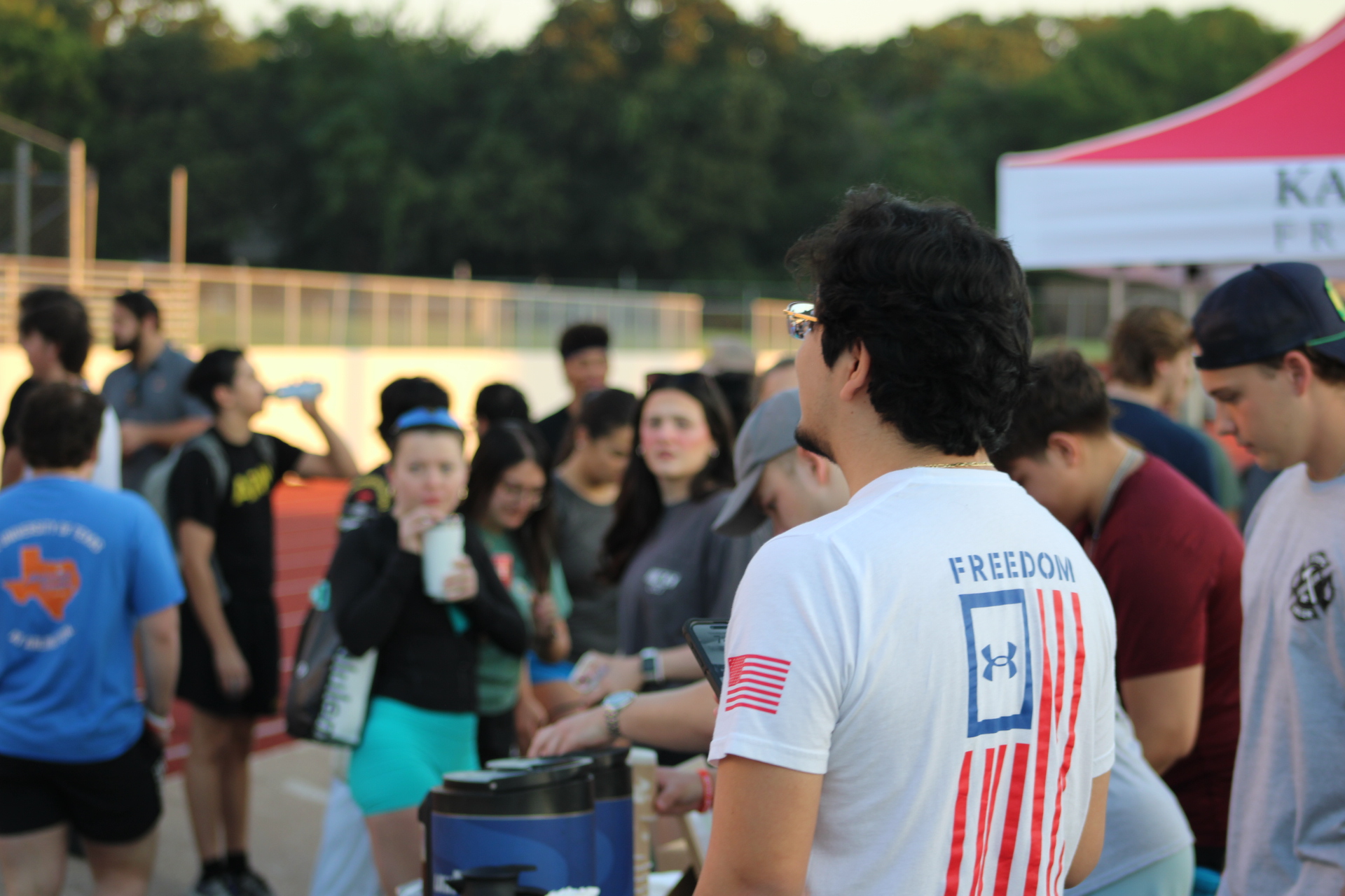 Volunteers helping attendees at an event table