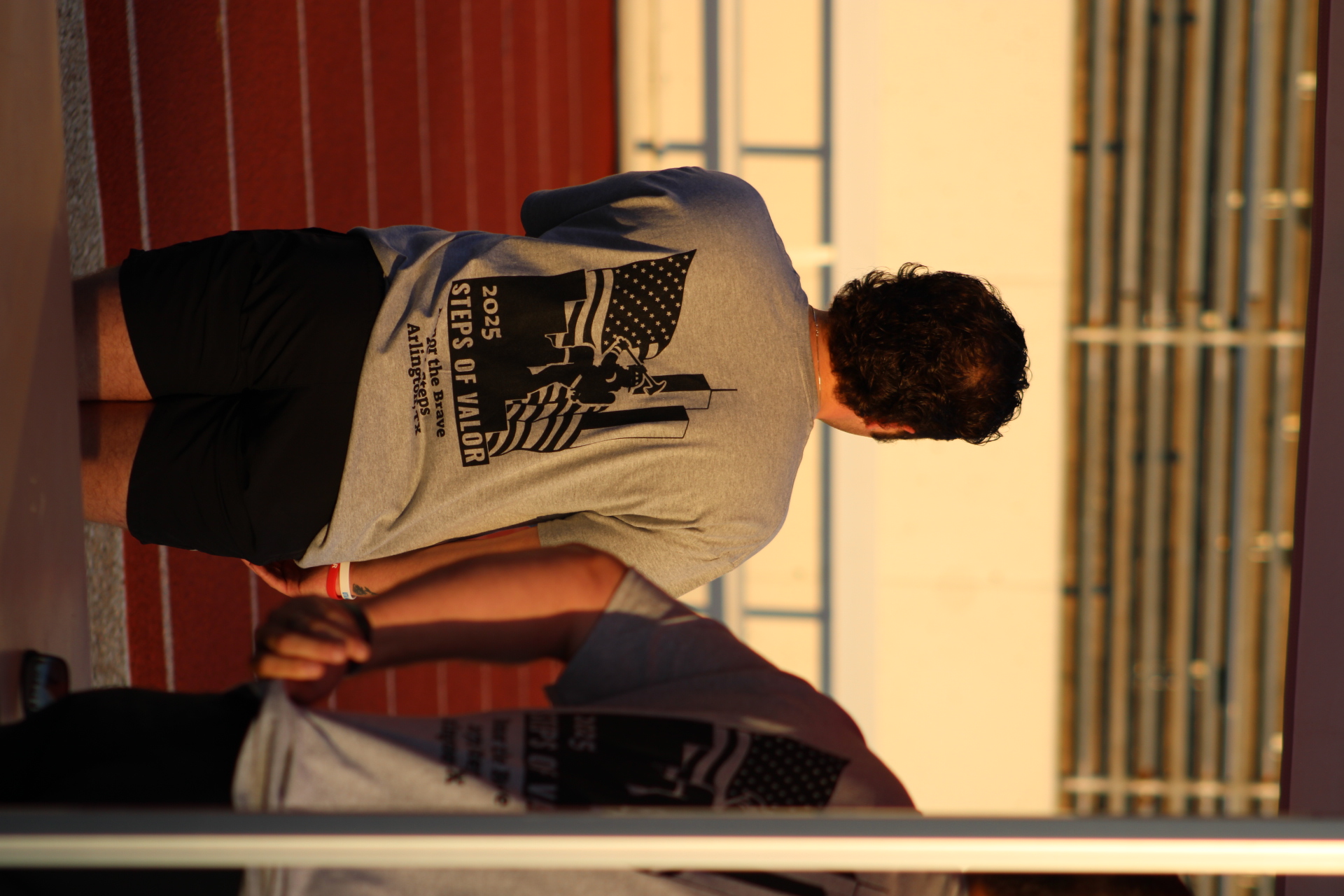 Participant pausing beside the stadium steps
