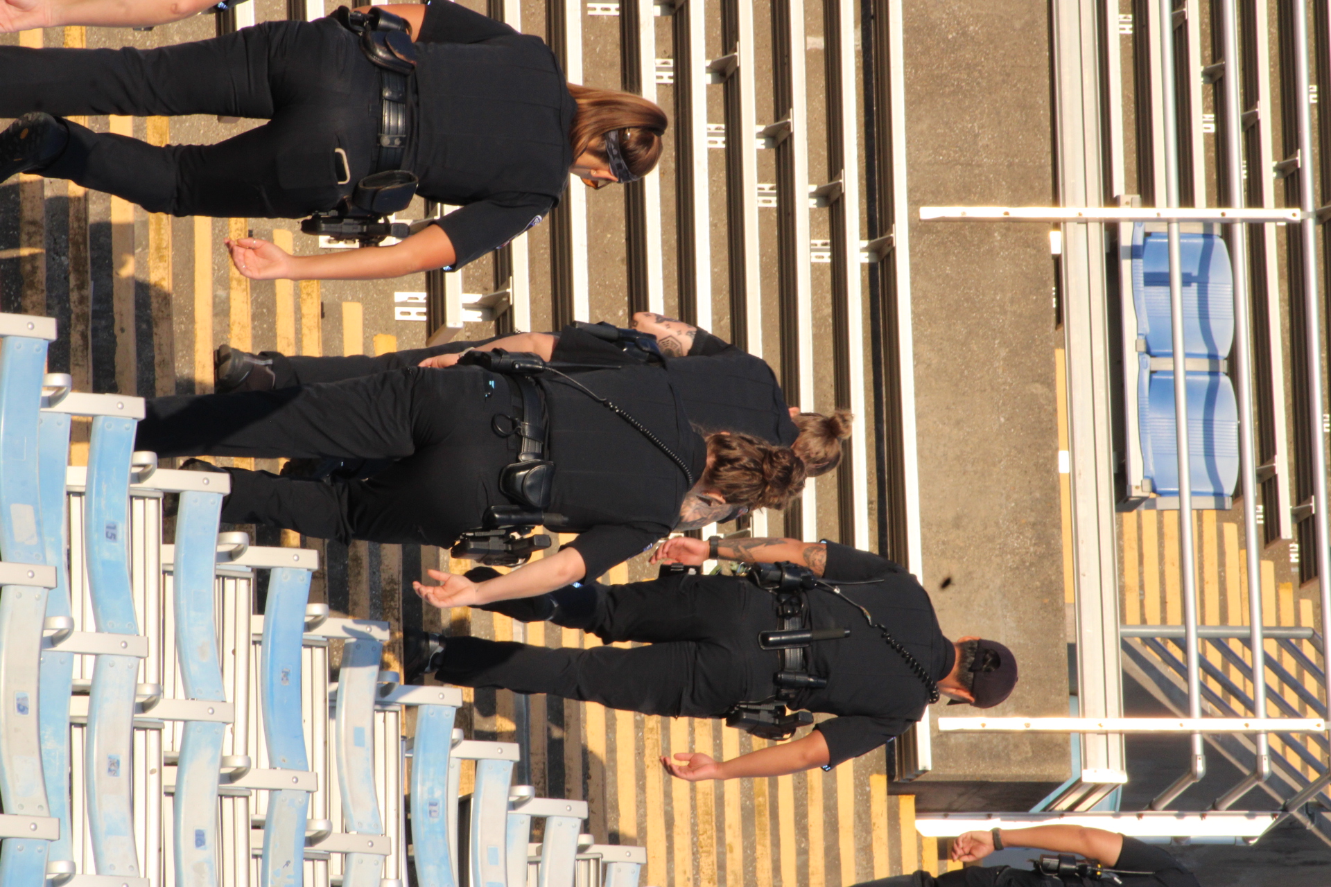 First responders and participants on the stadium steps