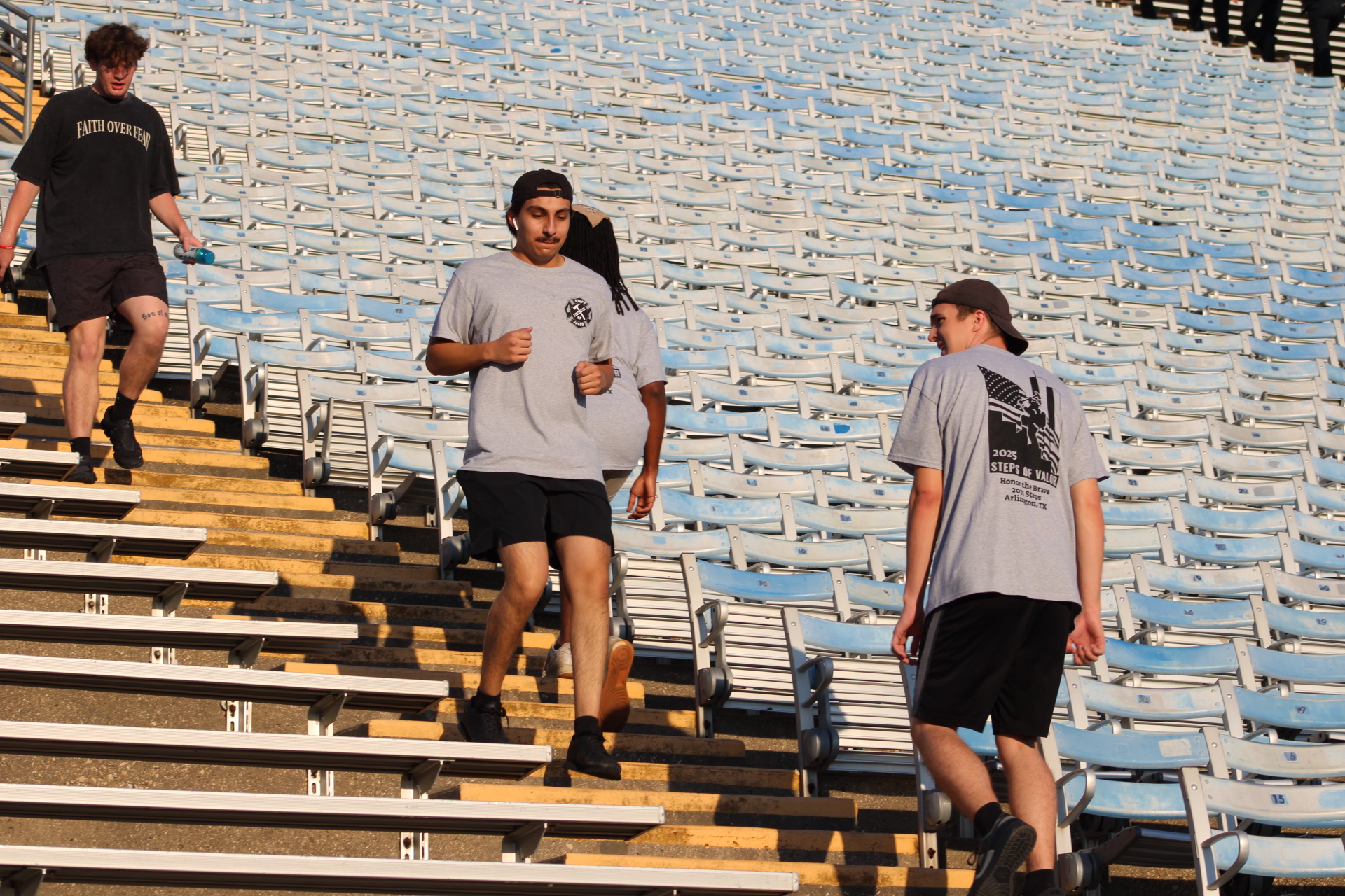 Participants ascending stadium stairs